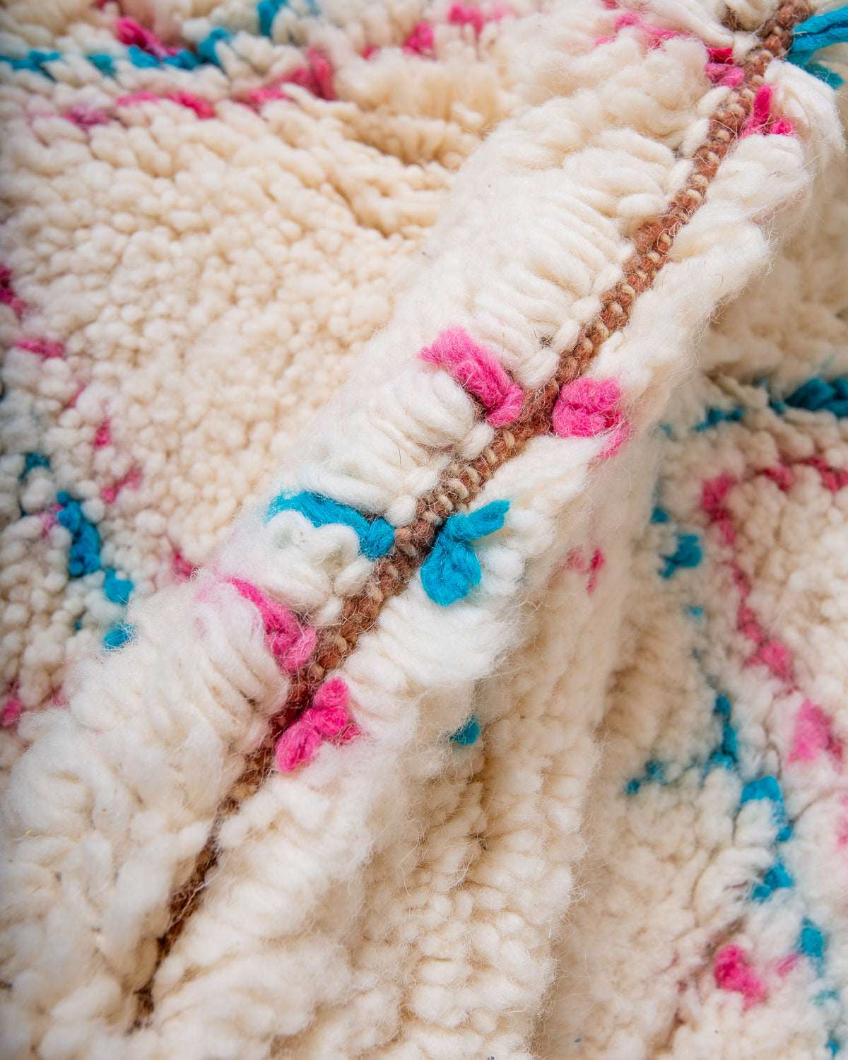 Modern, designer, handcrafted Berber rug from Morocco. Beniourain carpet with beautiful colours and patterns and fluffy wool texture.